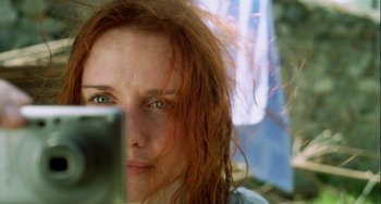 Movie still from “The Loneliest Planet” (2011), directed by Julia Loktev – A person with a cell phone; Close Up shot, Over the shoulder angle