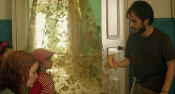 Movie still from “The Loneliest Planet” (2011), directed by Julia Loktev – A man and a little girl in front of a door; Medium shot, Over the shoulder angle