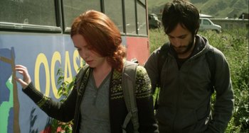 Movie still from “The Loneliest Planet” (2011), directed by Julia Loktev – A woman and a man are walking in a park; Medium shot, Low angle