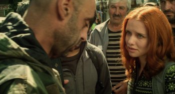 Movie still from “The Loneliest Planet” (2011), directed by Julia Loktev – A group of people standing next to each other on the street; Close Up shot, Over the shoulder angle