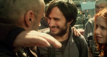 Movie still from “The Loneliest Planet” (2011), directed by Julia Loktev – A man with a beard is smiling at another man with a beard; Close Up shot, Over the shoulder angle