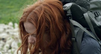 Movie still from “The Loneliest Planet” (2011), directed by Julia Loktev – A person with long red hair; Close Up shot, Over the shoulder angle