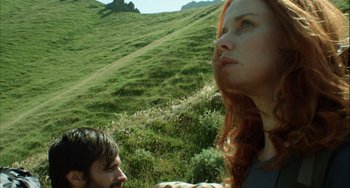 Movie still from “The Loneliest Planet” (2011), directed by Julia Loktev – A man and a woman standing on a hill side; Close Up shot, Low angle