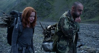 Movie still from “The Loneliest Planet” (2011), directed by Julia Loktev – A man and a woman walking on a rocky ground; Medium shot, Low angle