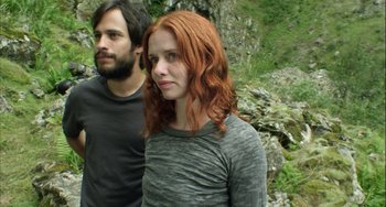 Movie still from “The Loneliest Planet” (2011), directed by Julia Loktev – A man and a woman standing next to each other; Close Up shot, Low angle