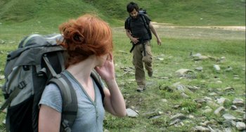 Movie still from “The Loneliest Planet” (2011), directed by Julia Loktev – A man and a woman walking through a field; Medium shot, Over the shoulder angle