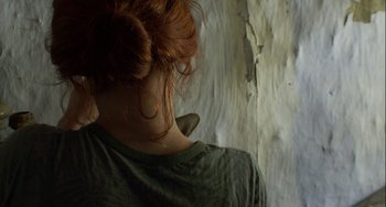 Movie still from “The Loneliest Planet” (2011), directed by Julia Loktev – A person with red hair; Close Up shot, Overhead angle