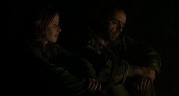 Movie still from “The Loneliest Planet” (2011), directed by Julia Loktev – A man and a woman in a dark room; Medium shot, Low angle