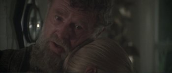 Movie still from “The Long Goodbye” (1973), directed by Robert Altman – An older man holding a young woman in his arms; Close Up shot, Over the shoulder angle