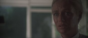 Movie still from “The Long Goodbye” (1973), directed by Robert Altman – A woman's face in front of a window; Close Up shot, Over the shoulder angle