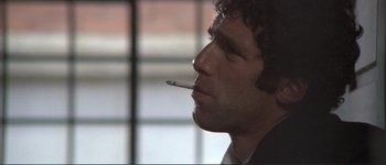 Movie still from “The Long Goodbye” (1973), directed by Robert Altman – A person smoking a cigarette; Close Up shot, Low angle