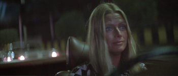 Movie still from “The Long Goodbye” (1973), directed by Robert Altman – A woman sitting in a chair with long blonde hair; Close Up shot, Over the shoulder angle