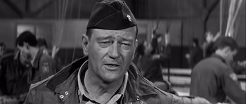 Movie still from “The Longest Day” (1962), directed by Ken Annakin – An older man wearing a hat and a jacket; Close Up shot, Low angle