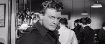 Movie still from “The Longest Day” (1962), directed by Ken Annakin – Black and white photograph of a man in a restaurant; Close Up shot, Low angle