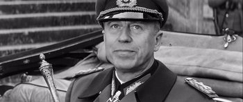 Movie still from “The Longest Day” (1962), directed by Ken Annakin – An older man in a military uniform and hat; Close Up shot, Low angle