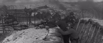 Movie still from “The Longest Day” (1962), directed by Ken Annakin – A black and white photo of a group of soldiers; Wide shot, High angle