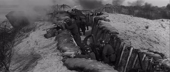 Movie still from “The Longest Day” (1962), directed by Ken Annakin – A black and white photo of soldiers in a trench; Wide shot, High angle