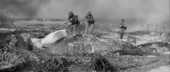 Movie still from “The Longest Day” (1962), directed by Ken Annakin – A black - and - white photo of two men in military gear; Wide shot, Low angle