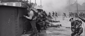 Movie still from “The Longest Day” (1962), directed by Ken Annakin – A black and white photo of men in uniform; Wide shot, Low angle