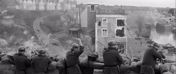Movie still from “The Longest Day” (1962), directed by Ken Annakin – A black and white photo of two men in military uniforms; Wide shot, High angle