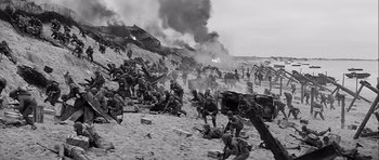 Movie still from “The Longest Day” (1962), directed by Ken Annakin – A black - and - white photo of a war scene; Extreme Wide shot, High angle