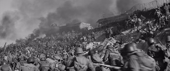 Movie still from “The Longest Day” (1962), directed by Ken Annakin – A black - and - white photo of a war scene; Extreme Wide shot, High angle