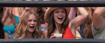 Movie still from “The Longest Ride” (2015), directed by George Tillman Jr. – A group of women standing next to each other; Close Up shot, Over the shoulder angle