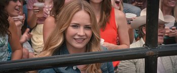 Movie still from “The Longest Ride” (2015), directed by George Tillman Jr. – A beautiful young lady sitting in front of a group of people; Close Up shot, Over the shoulder angle