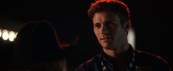 Movie still from “The Longest Ride” (2015), directed by George Tillman Jr. – A person wearing a blue shirt; Close Up shot, Over the shoulder angle