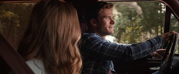 Movie still from “The Longest Ride” (2015), directed by George Tillman Jr. – A man and a woman sitting in a car; Close Up shot, Over the shoulder angle