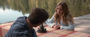 Movie still from “The Longest Ride” (2015), directed by George Tillman Jr. – A man and a woman sitting at a table; Medium shot, Over the shoulder angle