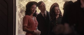 Movie still from “The Longest Ride” (2015), directed by George Tillman Jr. – A man and two women wearing hats and a man is standing next to a woman; Medium shot, Over the shoulder angle