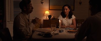 Movie still from “The Longest Ride” (2015), directed by George Tillman Jr. – Two people sitting at a dinner table with a lit candle; Medium shot, Over the shoulder angle