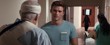 Movie still from “The Longest Ride” (2015), directed by George Tillman Jr. – A man in a blue shirt is talking to an older man; Close Up shot, Over the shoulder angle
