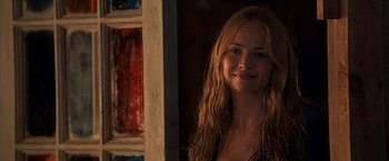 Movie still from “The Longest Ride” (2015), directed by George Tillman Jr. – A woman with long blonde hair smiling for the camera; Close Up shot, Over the shoulder angle