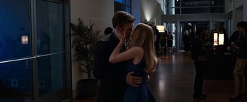 Movie still from “The Longest Ride” (2015), directed by George Tillman Jr. – A man and a woman kissing each other in a room; Medium shot, Over the shoulder angle