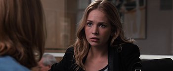 Movie still from “The Longest Ride” (2015), directed by George Tillman Jr. – A woman with long blonde hair and blue eyes looking at the camera; Close Up shot, Over the shoulder angle