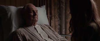 Movie still from “The Longest Ride” (2015), directed by George Tillman Jr. – An old man sitting in a hospital bed; Close Up shot, Over the shoulder angle