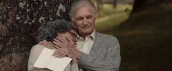 Movie still from “The Longest Ride” (2015), directed by George Tillman Jr. – An older man and a woman hugging in a park; Close Up shot, High angle
