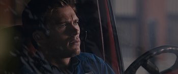 Movie still from “The Longest Ride” (2015), directed by George Tillman Jr. – A person wearing headphones; Close Up shot, Over the shoulder angle