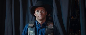 Movie still from “The Longest Ride” (2015), directed by George Tillman Jr. – A man wearing a cowboy hat and a vest; Close Up shot, Low angle