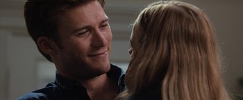 Movie still from “The Longest Ride” (2015), directed by George Tillman Jr. – A man and a woman smiling at each other; Close Up shot, Over the shoulder angle