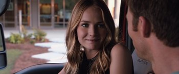 Movie still from “The Longest Ride” (2015), directed by George Tillman Jr. – A beautiful young lady sitting in front of a window; Close Up shot, Over the shoulder angle