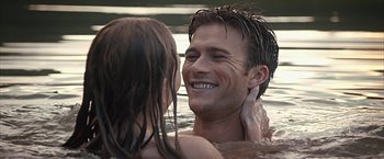 Movie still from “The Longest Ride” (2015), directed by George Tillman Jr. – A man and a little girl in a body of water; Close Up shot, Over the shoulder angle