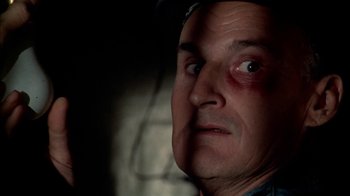 Movie still from “The Longest Yard” (1974), directed by Robert Aldrich – A person with a bruised eye; Close Up shot, Low angle