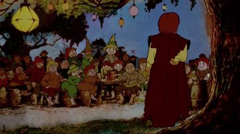 Movie still from “The Lord of the Rings” (1978), directed by Ralph Bakshi – A group of people sitting around a table; Wide shot, High angle