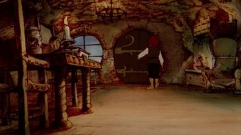 Movie still from “The Lord of the Rings” (1978), directed by Ralph Bakshi – An animated scene of a man in a cave; Wide shot, High angle