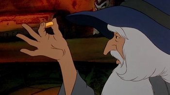 Movie still from “The Lord of the Rings” (1978), directed by Ralph Bakshi – An old man holding a pencil in his hand; Extreme Close Up shot, High angle