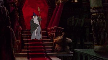 Movie still from “The Lord of the Rings” (1978), directed by Ralph Bakshi – A cartoon of gandalf on a set of stairs; Wide shot, Low angle