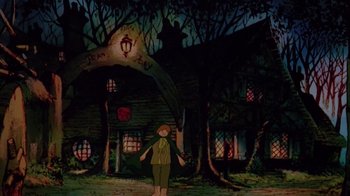 Movie still from “The Lord of the Rings” (1978), directed by Ralph Bakshi – A man standing in front of a house with a knife; Wide shot, Low angle